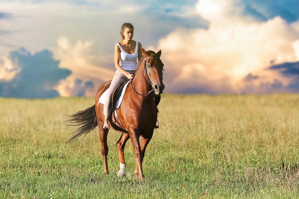 Women riding horse in Nevada grasslands outside of LAs Vegas.