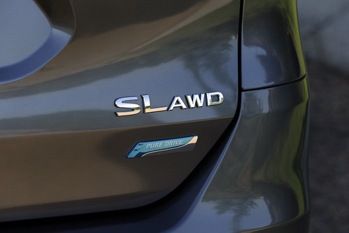 Close on symbol on rear of Nissan Rogue SL with AWD