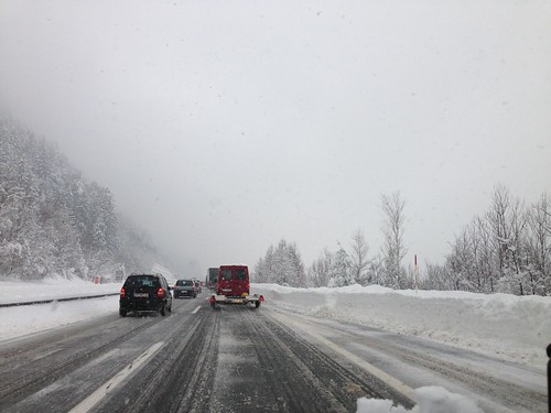 Cars on snowy highway that's been treated with road salt