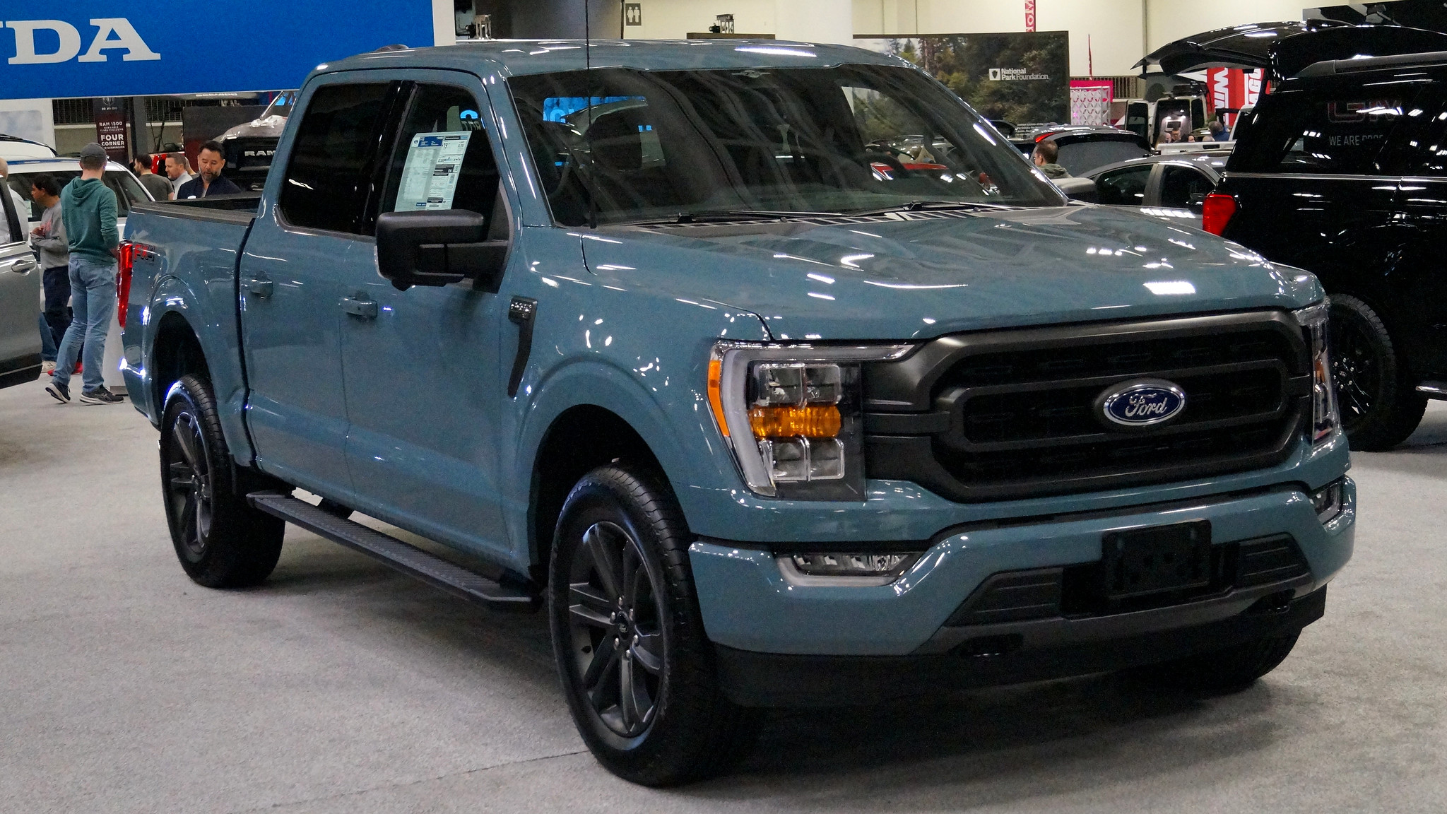 blue pickup truc parked in service