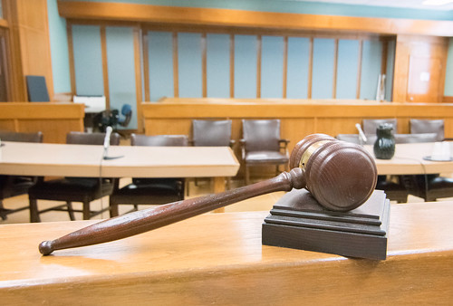 Hammer and Gavel on a ledge looking over a court room