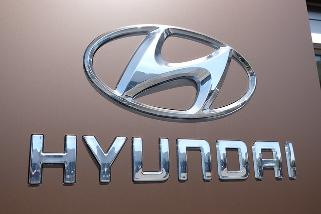 Close up of Hyundai logo in silver.