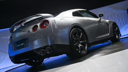 Low angle on silver Nissan sports car on display at auto show