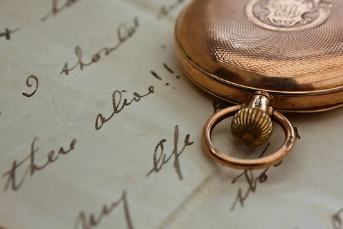 A handwritten document with a vintage compass 