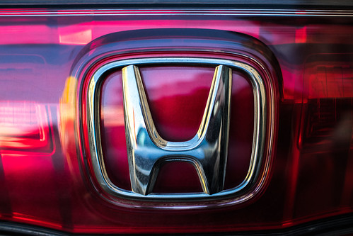 Honda logo on red Honda Accord