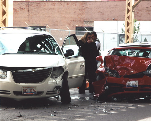 minivan and coupe crashed with shocked onlookers